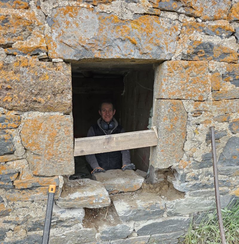 Jean-Sébastien, son of Jacques Ferlay, opens doors on a building